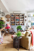 Colorful mix of styles in the living room with old books and houseplants