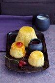 Small ricotta cakes with rosehip sauce