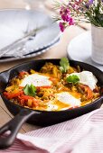Middle Eastern shakshuka (baked eggs, peppers and tomatoes) with gochujang