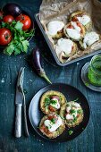 Aubergine pizza with tomatoes, parsley and pesto