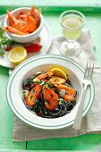 Squid ink tagliatelle with prawns, garlic and chilli