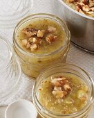 Gooseberry jam with walnuts in glass jars