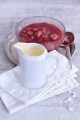 Strawberry and rhubarb compote with frothy woodruff sauce