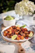 Fried potatoes with chillies and limes