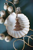 Old Christmas-tree bauble in scallop shell