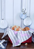 Pastries in bread basket lined with bunny-patterned cloth