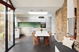 Dining set and brick wall in minimalist kitchen