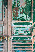 Vintage wooden door with peeling paint