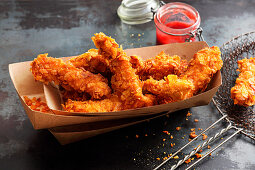 Deep-fried chicken strips with a cornflakes coking
