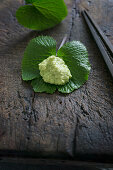 Grated wasabi on a wasabi leaf