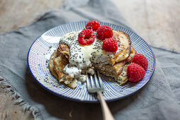 Gluten-free banana pancakes with raspberries and chia seeds