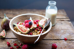 Granola with figs, berries and pomegranate seeds