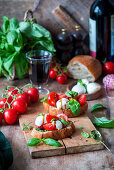 Bruschettas with pesto, mozzarella and tomatoes