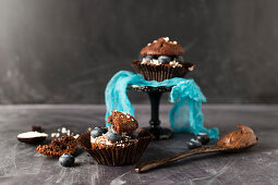 Chocolate muffins filled with chocolate cream and blueberries