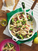 Penne pasta with cabbage, salami and broccoli