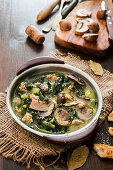 Soup with mushrooms, sausage and kale