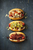 Spicy chilli dogs; Sauerkraut, pickle and mustard hot dogs; Hot dogs with sweet onion and capsicum relish