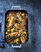 Sausages with braised lentils, lemon and green olives