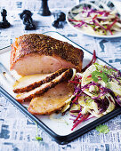 Roasted smoked pork with a fennel and mustard crust served with a fennel and beetroot salad