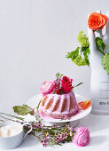 A pink Bundt cake decorated with flowers for Mother's Day