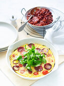 Omelette with chorizo and tomatoes served with chilli beans