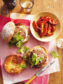 Lamb burgers and patatas bravas