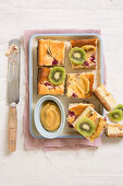 Kiwi and raspberries slices with caramel cream