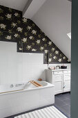 Dark floral wallpaper in classic attic bathroom