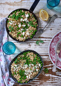Barley risotto with peas, spring onions, feta cheese and lemons
