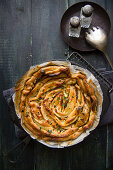 Spicy puff pastry cakes with courgettes, feta cheese and honey