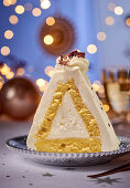 A Christmas sponge cream cake shaped like a pyramid