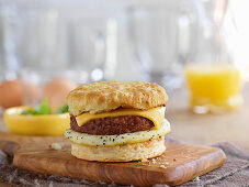 An English muffin burger with egg and cheese