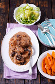 Pork loin with prunes in cream sauce, sweet potatoes