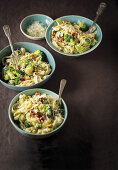Pasta with broccoli, lemon, feta cheese and almonds