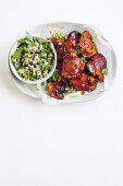 Sticky harissa chicken with couscous salad
