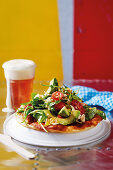 Langos (Hungarian unleavened bread) with cherry tomatoes and avocado