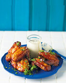 Sticky chicken wings with a blue cheese dip