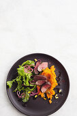 Sumac crusted lamb with carrot smash and mint salad
