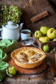 Apple pie with baked custard and whole apples