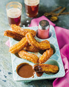 Churros with hot chocolate sauce for New Year's Eve