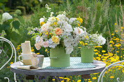 White-yellow bouquet of roses and meadow flowers