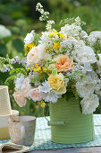 White-yellow bouquet of roses and meadow flowers