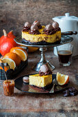 Pumpkin and orange cheesecake with a brownie base and macarons