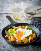 Curried hash with sunny-side eggs