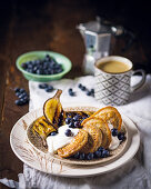 Pancakes with blueberries, grilled bananas and yoghurt