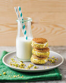 Ice cream sandwiches with ginger ice cream and pistachios