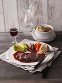 Saddle of venison with herb dumplings and vegetables