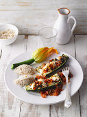 Stuffed courgette with feta cheese and tomatoes served with millet
