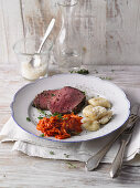 Beef fillet with herbs, gnocchi and a carrot dip