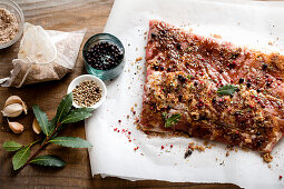 Still life with bacon, garlic, peppercorns and brown sugar